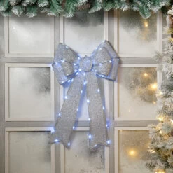 Festive Silver Battery Operated Christmas Door Bow With 84 Cool White LEDs -Home Lighting Store P036709 56967.1702634835